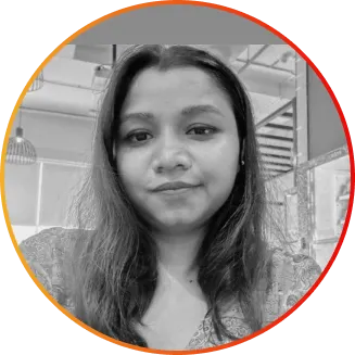 Portrait of a woman with shoulder-length hair looking at the camera, inside a circular frame with an orange border.