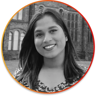 Portrait of a smiling young woman facing the camera, with a university building in the gray background, framed in a circular orange border.